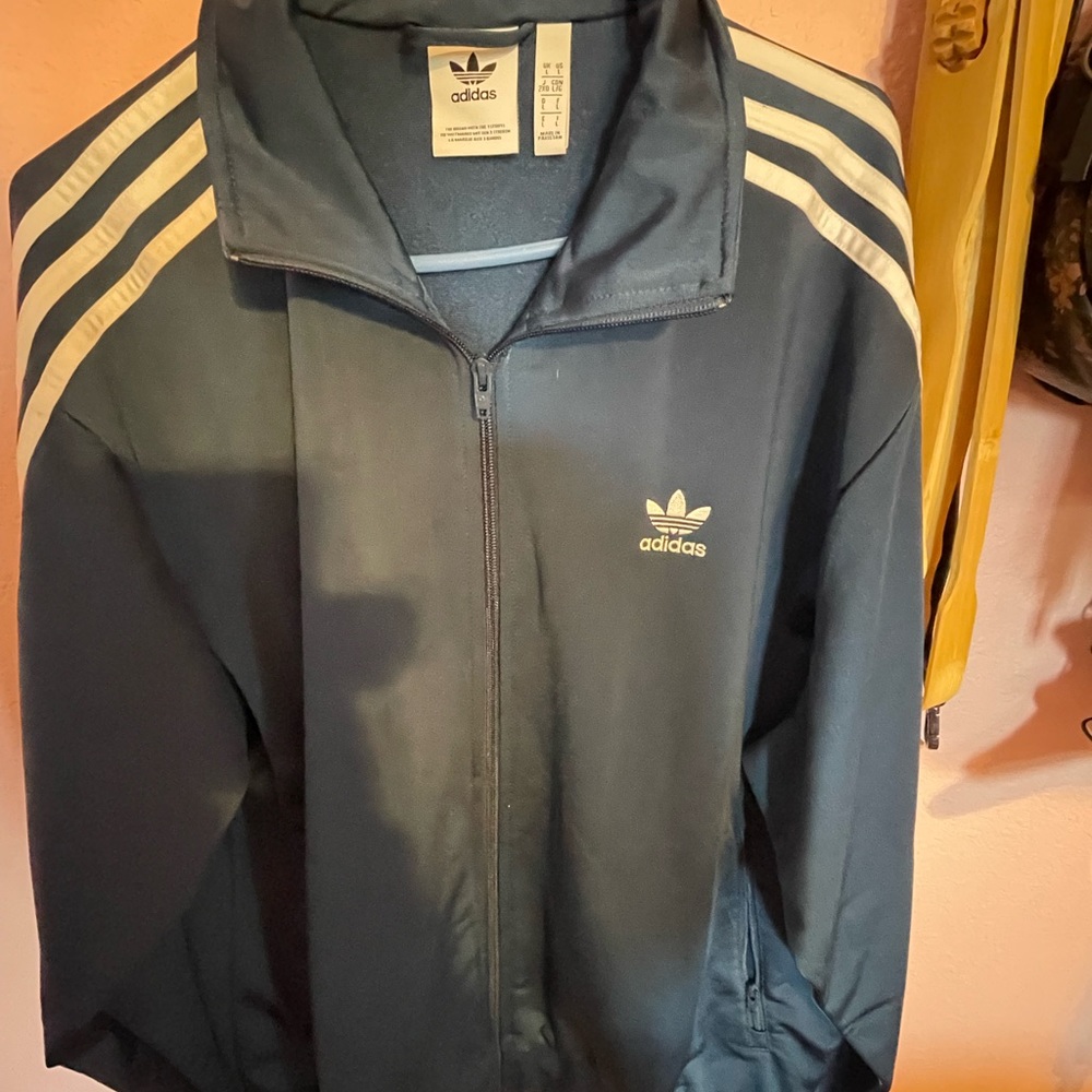 Mens adidas track jacket, blue 100% polyester.